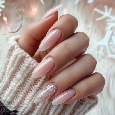 Female hand with glitter nail design. Glitter silver nail polish manicure. Woman hand with winter manicure.